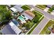 Aerial view of a single-Gathering home with a private backyard pool and lush landscaping at 12933 90Th Ave, Seminole, FL 33776