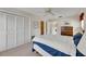 Well-lit bedroom featuring a closet and access to an ensuite bathroom at 12933 90Th Ave, Seminole, FL 33776