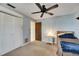 Cozy bedroom with carpet, closet and a ceiling fan providing a relaxing space at 12933 90Th Ave, Seminole, FL 33776