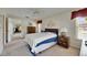 Sunlit bedroom with carpet and view of attached living room at 12933 90Th Ave, Seminole, FL 33776