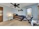 Inviting bedroom with a ceiling fan and large window, offering a comfortable living space at 12933 90Th Ave, Seminole, FL 33776