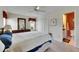 Comfortable bedroom featuring neutral tones, closet, and an adjacent bathroom at 12933 90Th Ave, Seminole, FL 33776