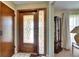 Welcoming entryway featuring a decorative glass front door, tiled floors, and a traditional-style interior at 12933 90Th Ave, Seminole, FL 33776