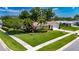Well-maintained single-Gathering home with lush lawn, mature trees, and an inviting front entrance at 12933 90Th Ave, Seminole, FL 33776