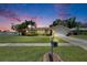 Charming single-story home featuring lush landscaping, a well-manicured lawn, and a classic mailbox at 12933 90Th Ave, Seminole, FL 33776