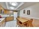 Bright kitchen and breakfast nook featuring tile floors, wooden cabinets, and recessed lighting at 12933 90Th Ave, Seminole, FL 33776