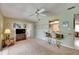 Comfortable living space featuring a built-in bar, neutral carpet, and a view into other rooms at 12933 90Th Ave, Seminole, FL 33776