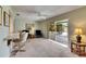 Bright living room with a ceiling fan, access to the patio, and comfortable seating arrangement at 12933 90Th Ave, Seminole, FL 33776