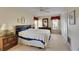 Serene main bedroom with a queen bed, dresser, and a spacious closet for ample storage at 12933 90Th Ave, Seminole, FL 33776
