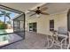 Relaxing screened patio with brick flooring offering a view of the pool area at 12933 90Th Ave, Seminole, FL 33776