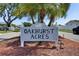 Oakhurst Acres community sign with palm trees providing a welcoming entrance at 12933 90Th Ave, Seminole, FL 33776