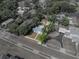 A charming home and its lot are outlined in this aerial view, showcasing proximity to surrounding areas at 14049 12Th St, Dade City, FL 33525