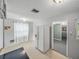 Bright kitchen with linoleum flooring, large fridge, and open access to other rooms at 14049 12Th St, Dade City, FL 33525