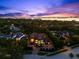 Luxurious estate aerial view highlighting the impressive home, surrounded by lush greenery and waterfront views at 1600 Magnolia Rd, Belleair, FL 33756