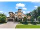 Beautiful home with meticulous landscaping, brick driveway and gated entrance at 1600 Magnolia Rd, Belleair, FL 33756