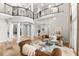 Spacious foyer with grand staircase, columns, and an open floor plan for entertaining at 1600 Magnolia Rd, Belleair, FL 33756