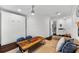 Comfortable living room with a rustic wooden coffee table, ceiling fan, and stylish decor at 1600 Magnolia Rd, Belleair, FL 33756