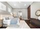 Cozy bedroom featuring wood floors, recessed lighting, area rug, and lots of storage space at 1600 Magnolia Rd, Belleair, FL 33756