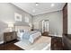 Comfortable bedroom with wood floors, recessed lighting, and a ceiling fan at 1600 Magnolia Rd, Belleair, FL 33756