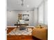 Cozy home office with wood floors, a stylish desk, and plenty of natural light at 1600 Magnolia Rd, Belleair, FL 33756