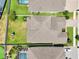 An aerial view displays the roof and backyard of a home within a community at 1741 Cherry Walk Rd, Lutz, FL 33558