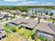 An aerial view shows the fenced backyard with a well-maintained lawn, screened-in patio, playground and pool at 1741 Cherry Walk Rd, Lutz, FL 33558