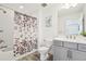 Bathroom features a shower-tub combo with modern fixtures and a grey vanity at 1741 Cherry Walk Rd, Lutz, FL 33558