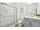 Bathroom with glass-enclosed shower, toilet, and vanity with a modern sink at 1741 Cherry Walk Rd, Lutz, FL 33558