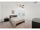 Bedroom featuring carpet, a ceiling fan, a bed, and two windows at 1741 Cherry Walk Rd, Lutz, FL 33558