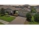 Charming home with stone accents, lush landscaping, brick driveway, and a two-car garage at 1741 Cherry Walk Rd, Lutz, FL 33558