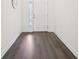 Inviting foyer featuring sleek, dark-toned hardwood flooring and a bright, airy ambiance at 1741 Cherry Walk Rd, Lutz, FL 33558