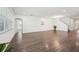 Expansive living area with rich flooring, recessed lighting, and a versatile layout for modern living at 1741 Cherry Walk Rd, Lutz, FL 33558