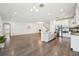 Open-concept layout connecting the living area to a modern kitchen with stainless steel appliances at 1741 Cherry Walk Rd, Lutz, FL 33558