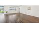 Open living space with modern flooring, large windows, and abundant natural light, creating a welcoming atmosphere at 1741 Cherry Walk Rd, Lutz, FL 33558