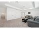 Spacious living room with a comfortable seating area and carpeted floor at 1741 Cherry Walk Rd, Lutz, FL 33558