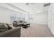 Living room with abundant natural light, comfortable seating, and neutral decor at 1741 Cherry Walk Rd, Lutz, FL 33558