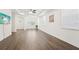 Large main bedroom with lots of natural light, wood floors, and tray ceiling at 1741 Cherry Walk Rd, Lutz, FL 33558