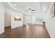 Expansive main bedroom with tray ceiling, wood floors, and walk-in closet at 1741 Cherry Walk Rd, Lutz, FL 33558