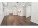 Bright main bedroom boasts tray ceiling, dark wood floors, and ensuite bath at 1741 Cherry Walk Rd, Lutz, FL 33558