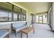 Screened patio features comfortable seating and an outdoor view at 1741 Cherry Walk Rd, Lutz, FL 33558