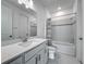 Bright bathroom featuring white cabinetry, quartz countertop, and tiled shower/tub combination at 17683 Ramble On Way, Land O Lakes, FL 34638