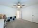 Bedroom showcasing a ceiling fan, a bookshelf, and an organizer cubby at 17683 Ramble On Way, Land O Lakes, FL 34638