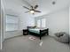 Bright bedroom featuring a ceiling fan, a cute rocket rug, and a beanbag chair at 17683 Ramble On Way, Land O Lakes, FL 34638