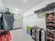 Spacious walk-in closet with custom shelving, providing ample storage space for clothes and luggage at 17683 Ramble On Way, Land O Lakes, FL 34638