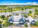 Aerial view of the community clubhouse, a social hub with architectural style and landscaping at 17683 Ramble On Way, Land O Lakes, FL 34638