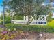 Bexley Club community sign surrounded by manicured landscaping and colorful flower beds at 17683 Ramble On Way, Land O Lakes, FL 34638