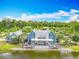 Stunning waterfront home with a spacious deck, perfect for enjoying scenic views at 17683 Ramble On Way, Land O Lakes, FL 34638