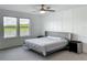 Spacious main bedroom with plush carpeting, decorative paneling, and an exterior view of the lake at 17683 Ramble On Way, Land O Lakes, FL 34638
