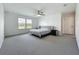 Spacious main bedroom featuring carpet, decorative trim, and windows with a beautiful water view at 17683 Ramble On Way, Land O Lakes, FL 34638