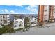 Aerial view of beachfront townhomes and condo featuring a shared pool and beach access at 17960 Gulf Blvd # 225, Redington Shores, FL 33708